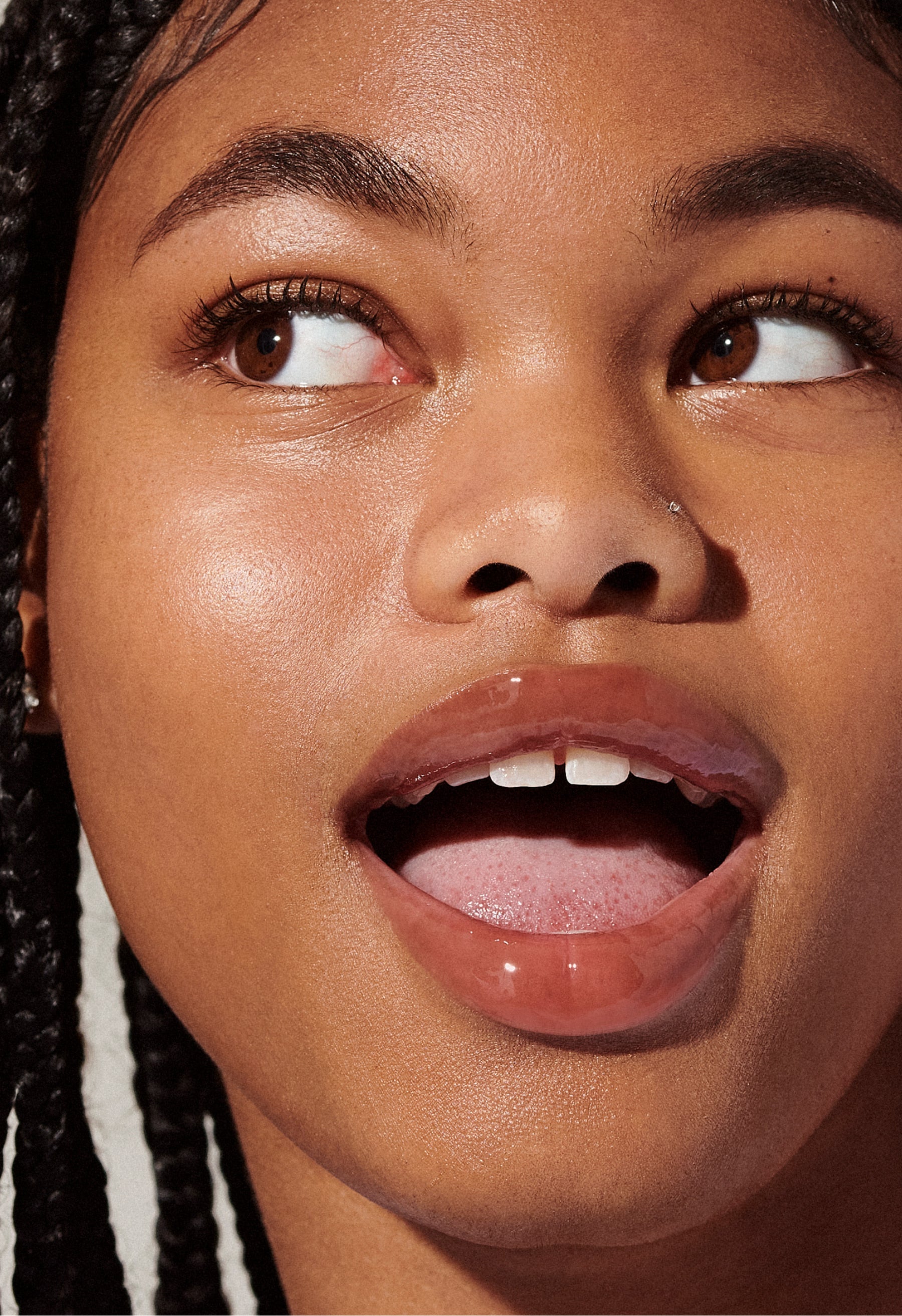 Model with glossy, tinted lips - wearing Toast Lip Tint