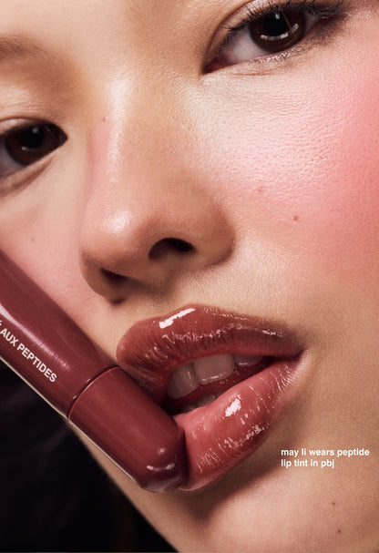 may li wears peptide lip tint in pbj