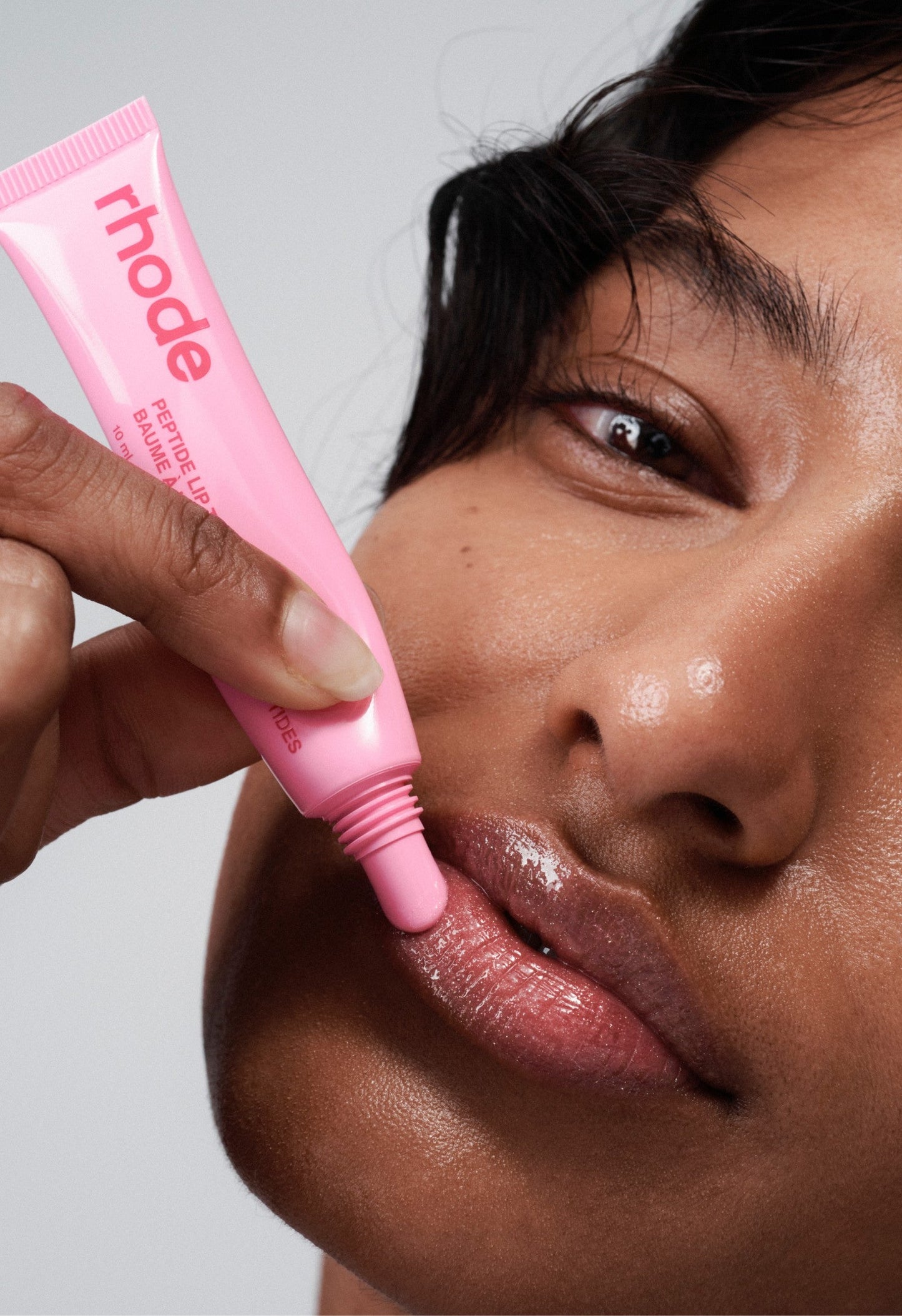 model wearing peptide lip tint jelly bean
