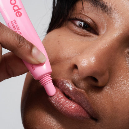 model wearing peptide lip tint jelly bean