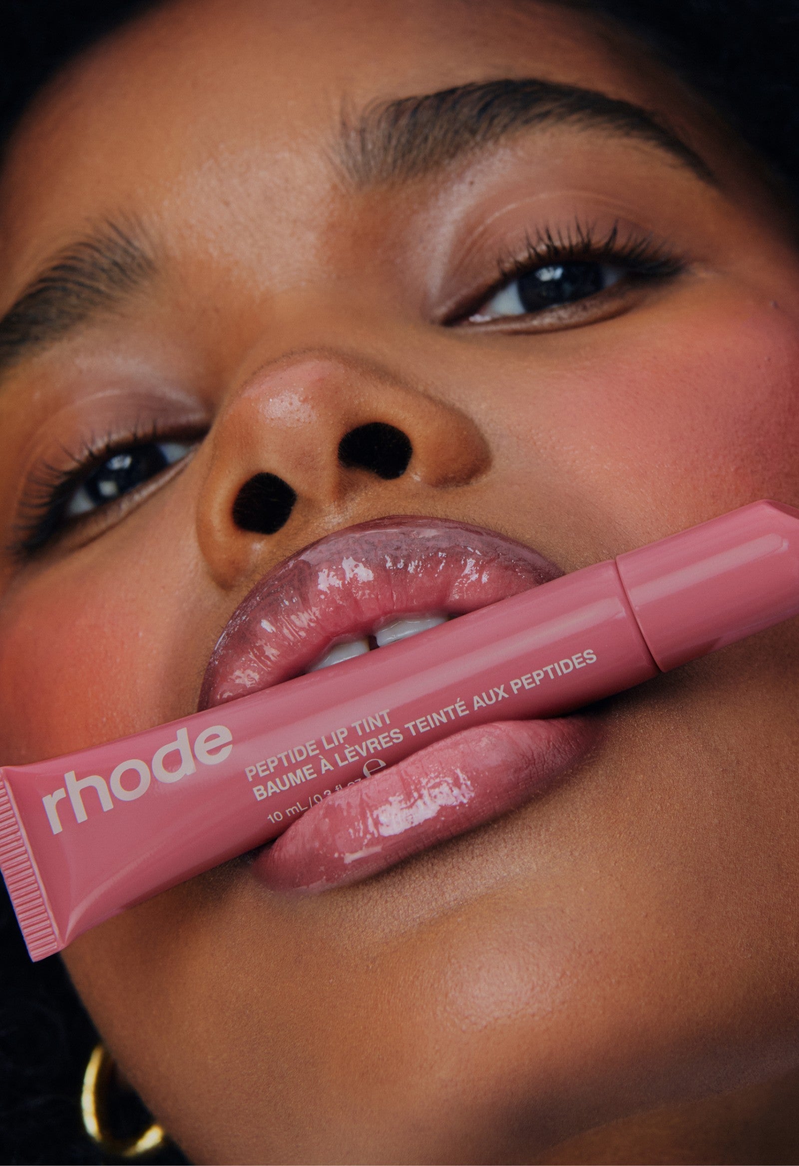 model with peptide lip tint salty tan