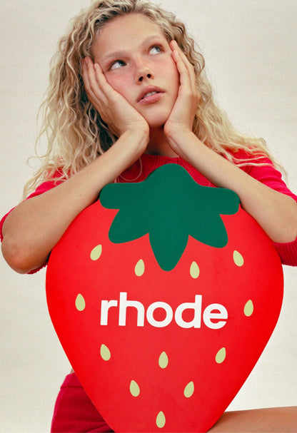 Anna with a strawberry design and 'rhode' branding.